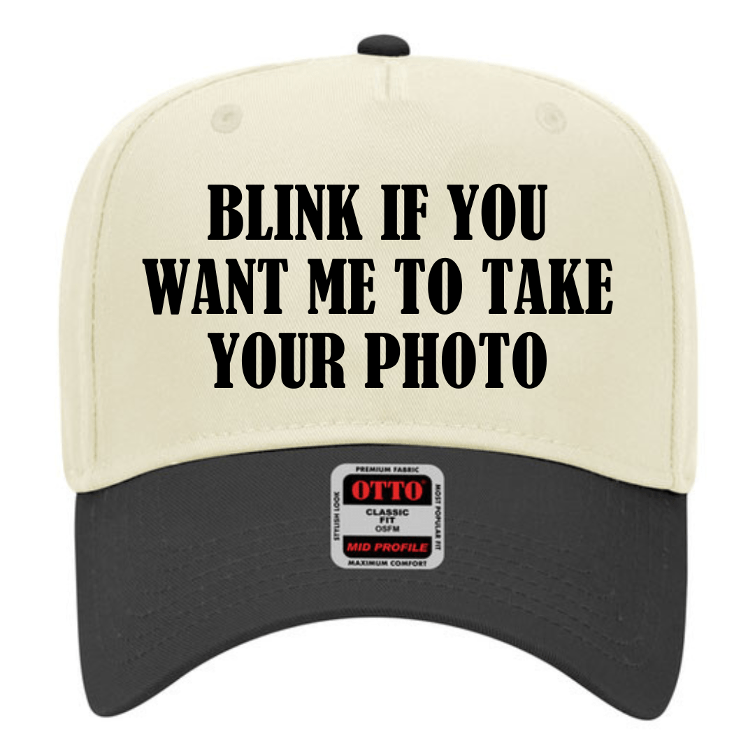 Blink if you want me to take your photo- Trucker Hat